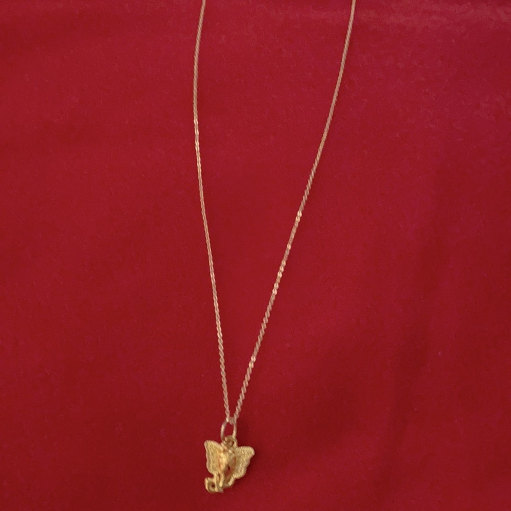 Gold plated necklace with elephant charm.
